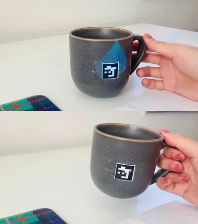 The user noticed the digital cup and grasped the cup, The projection and reminder function was stopped once the cup is moved