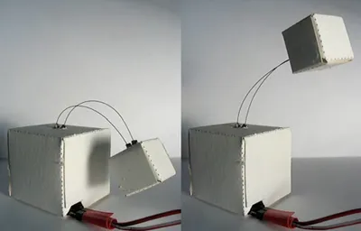 Figure 1. A paper device: Interactive sleeping box toy (SMA and paper) responds physically to ambient noise.