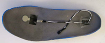 A FSR is attached to the sole of a shoe