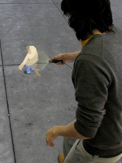 Figure 8. This concept image 
shows how we envision interacting 
with a character using a handheld 
projector.